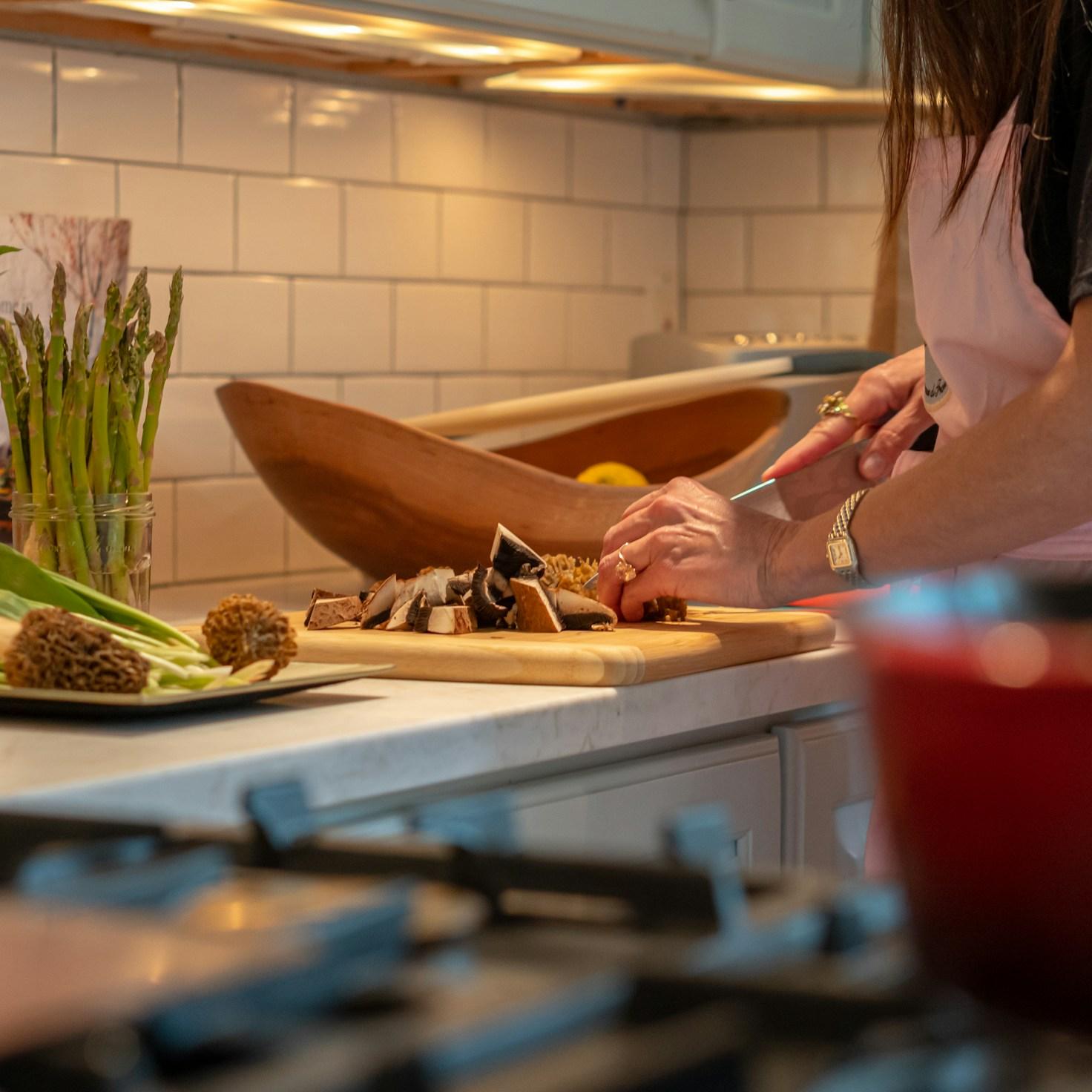 Diverse group of community members sharing a meal together, showcasing the social bonds formed through collaborative cooking